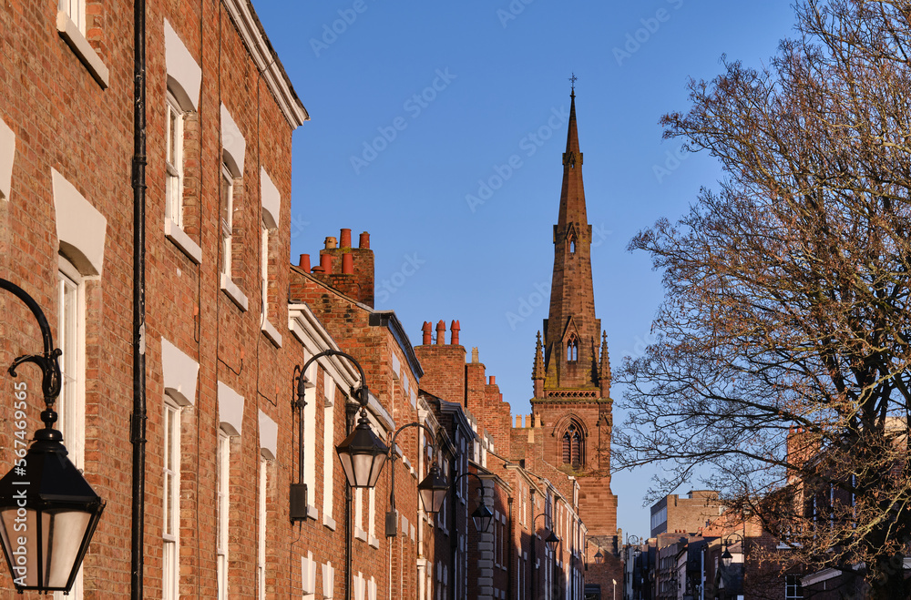 city street with Georgian buildings and church spire, Chester, UK