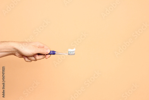 hand holding tooth brush