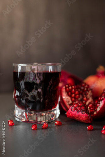 delicious healthy fruit pomegranate red with juice in a glass