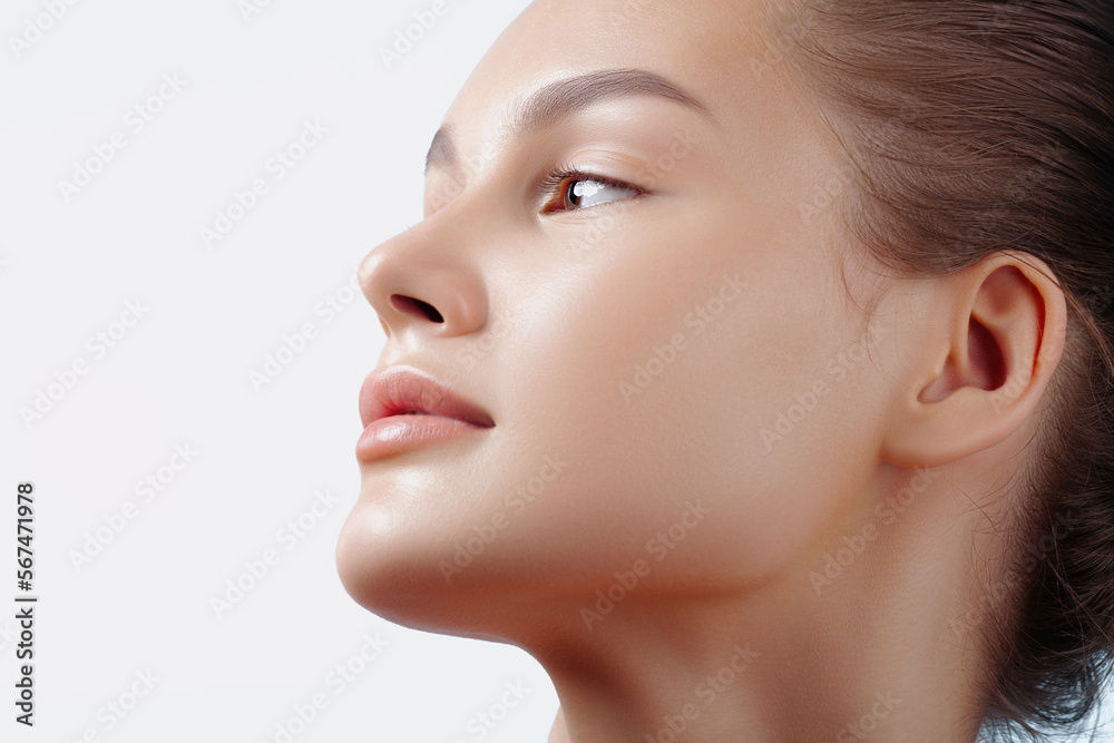 Face of young beautiful woman in closeup. Clear skin, nude makeup Face of young beautiful woman in closeup. Clear skin, nude makeup