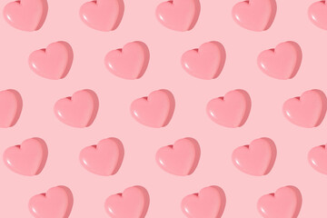 Valentines day creative pattern with baby pink hearts on pastel pink background. 80s or 90s retro fashion aesthetic love concept. Minimal romantic idea.
