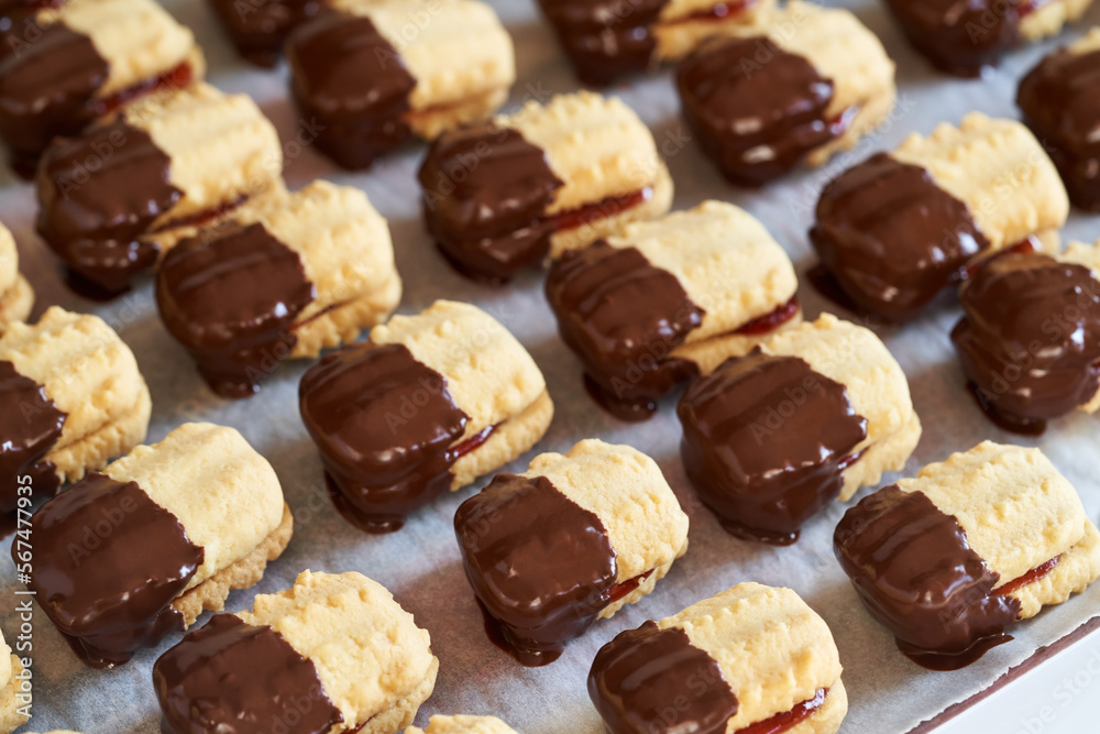 Christmas cookie filled with marmalade and dipped in chocolate Christmas cookie filled with marmalade and dipped in chocolate