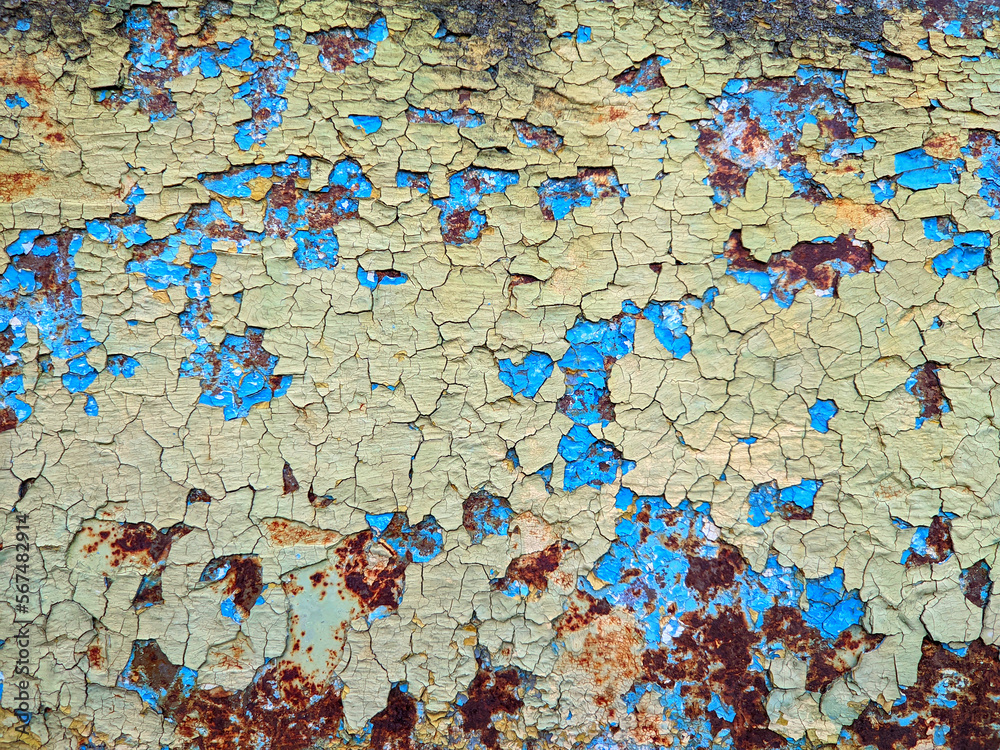 painted metal surface with peeling paint and rust