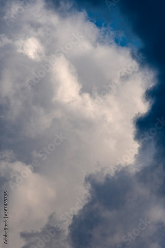 close up of fluffy light and dark cumulus clouds