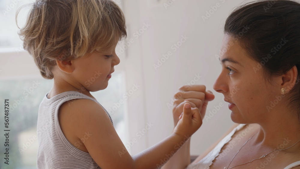 Mother and son doing pinky swear. Parent and child promise. Mom and kid relationship based on trust. Education commitment concept