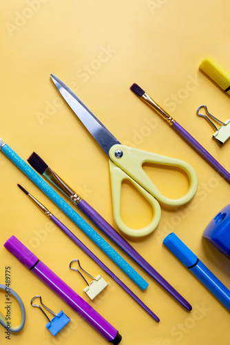 Colorful stationary school supplies on yellow trending background, space or text flat lay.various school items.Back to school concept