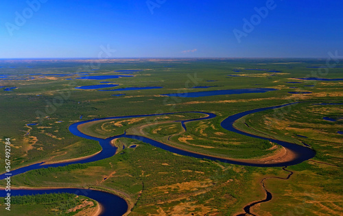 Northern lowland tundra with swamps, lakes and river meanders in spring Fototapet