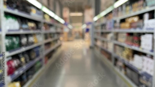 Wallpaper Mural Blurred background when walking through the supermarket. Blurred background of a supermarket interior with shelves from up to the ceiling. Hall or mall with blurred lights background Torontodigital.ca
