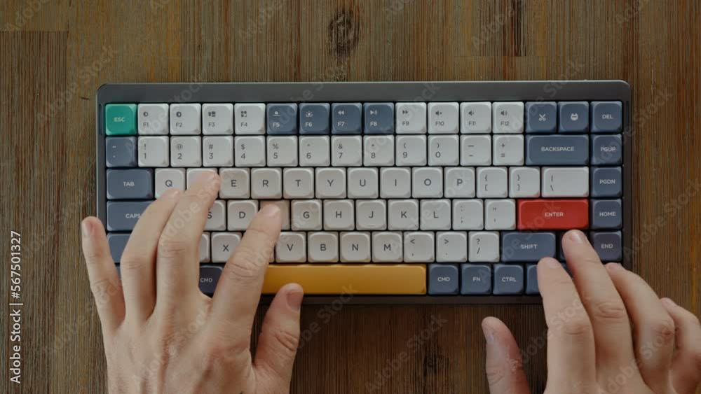 Hit Keyboard Hacker hands nervously hit buttons on keyboard lying on the wooden ...