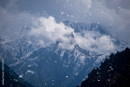 Snow covered mountain with clouds © ABHINABA