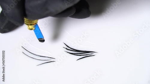 permanent tattoo master draws eyebrows. Permanent makeup. beauty salon workout