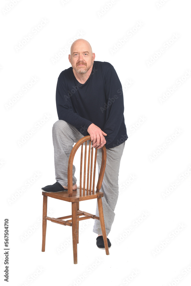 man with pajamas and chair