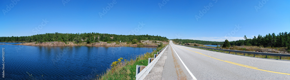 A beautiful highway scene in panorama in Manitoulin, ON, Canada