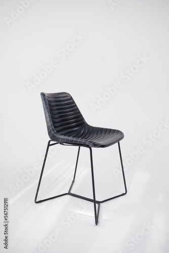 Black armchair. Modern designer chair on white background. Texture chair.