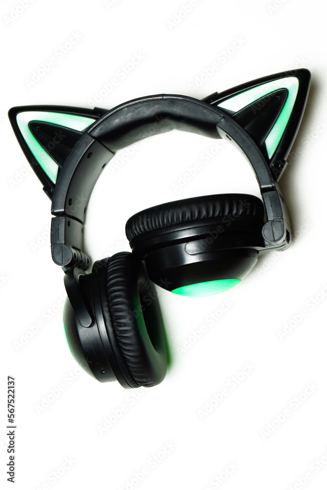 Black wireless headphones isolated on a white background. A cosplay accessory. Wireless gaming headset with a cat ear. With backlight. Front View