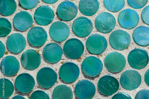 mosaic of scratched glass tiles as a decor in architecture. Old round tiles