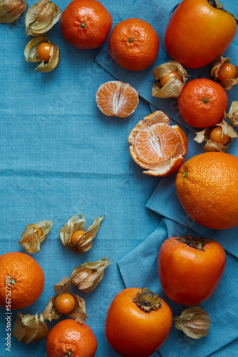 oranges and tangerines on a blue background