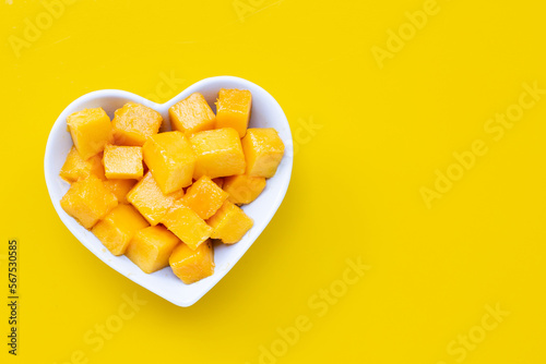 Tropical fruit, Mango on yellow background. Top view