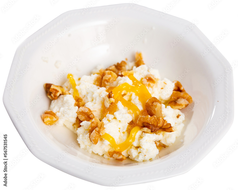 Mato, fresh whey cheese of Catalonia, served on plate with honey and nuts. Traditional Spanish dish. Isolated over white background