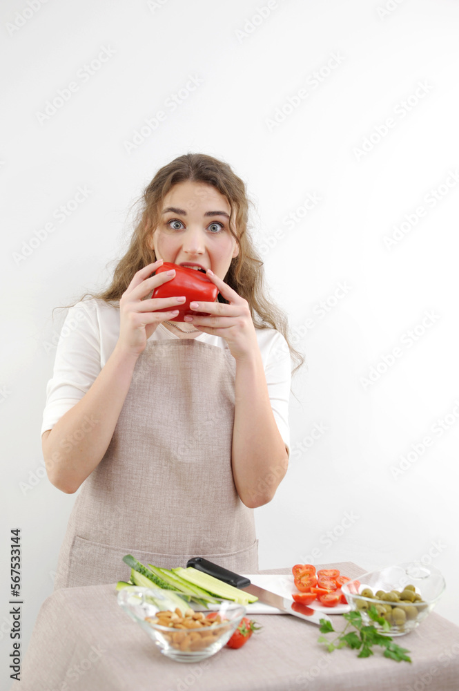 biting sweet pepper woman happy smile cute woman cooking at home happy young woman biting red pepper teenager beautiful girl close-up healthy food diet proper food biting sweet pepper woman happy smile cute woman cooking at home happy young woman biting red pepper teenager beautiful girl close-up healthy food diet proper food