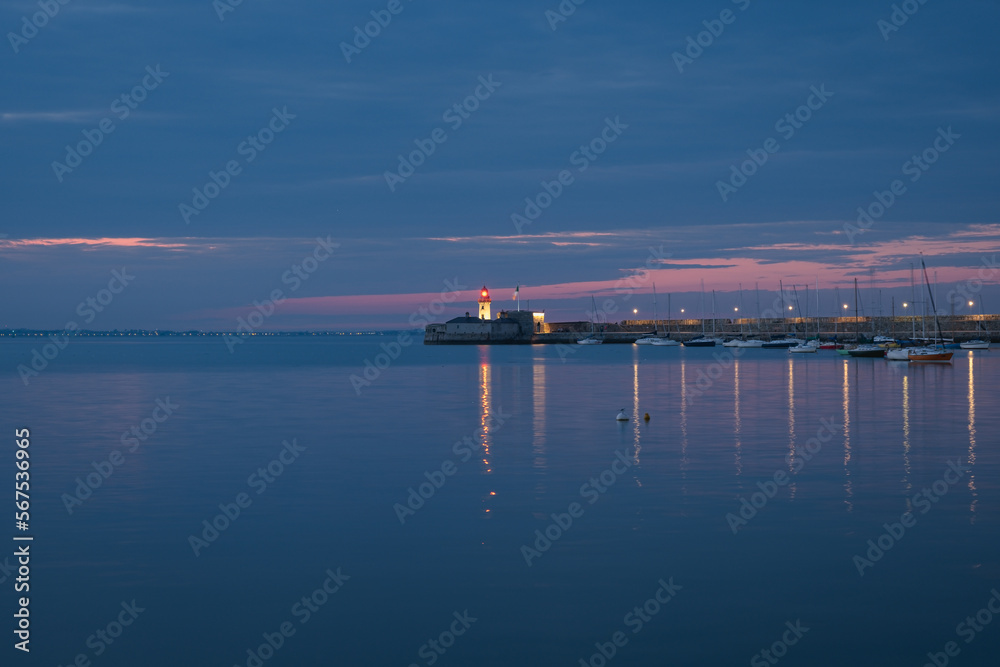 Dun Laoghaire pier during blue hour, lighthouse and boats, long exposure, Dublin, Ireland