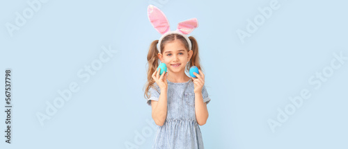Little girl with Easter egg...