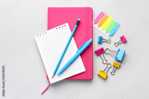Set of stationery with notebooks on light background
