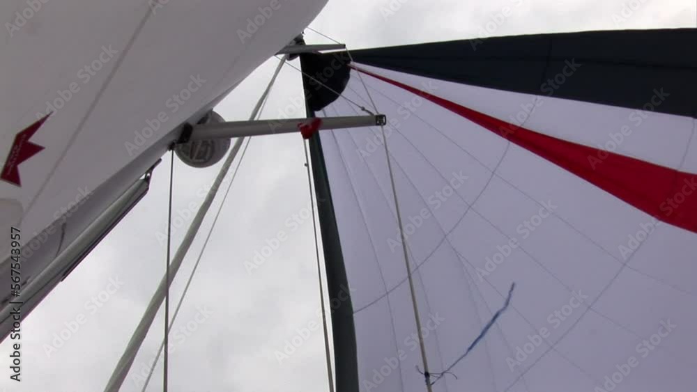 Deck of moving sailing yacht with white sails. Sea journey and yachting as an active lifestyle.