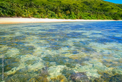 Obraz na płótnie Tropical sandy beach at summer day in Fiji Islands, Pacific ocean w salonie
