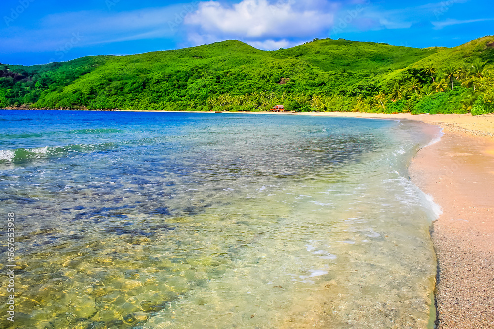 Tropical sandy beach at summer day in Fiji Islands, Pacific ocean