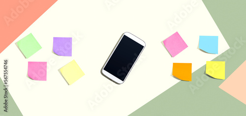 Smartphone with many colurful sticky notes from above
