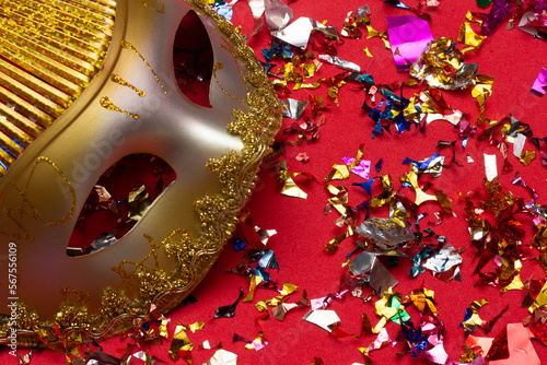 colorful carnival mask on the red background with several ornaments