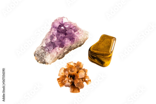 Gemstones crystals minerals isolated on white background, amethyst, tiger eye and aragonite