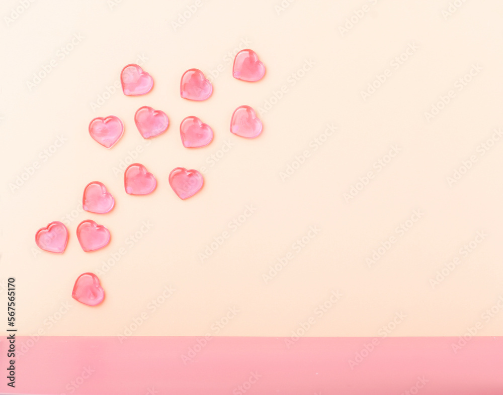 Pink hearts floating on beige background