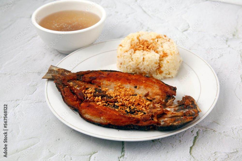 Freshly cooked Filipino food called fried bangus or milkfish and fried