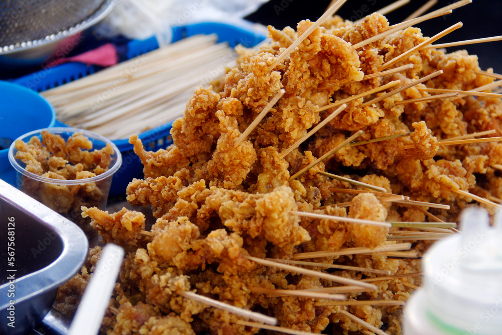Freshly cooked Filipino street food called Bato bato or fried chicken gizzard. Stock Photo
