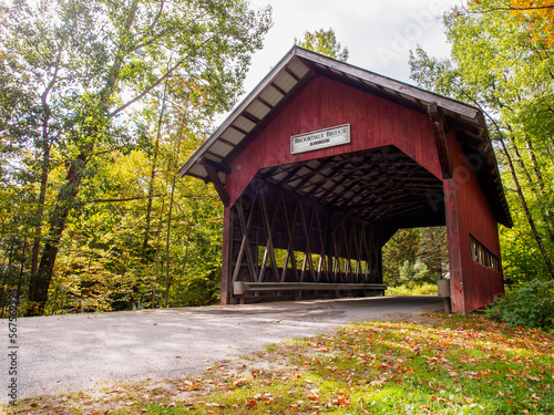 Brookdale Bridge is a covered bridge in red painted wood in Stowe, Vermont. photo