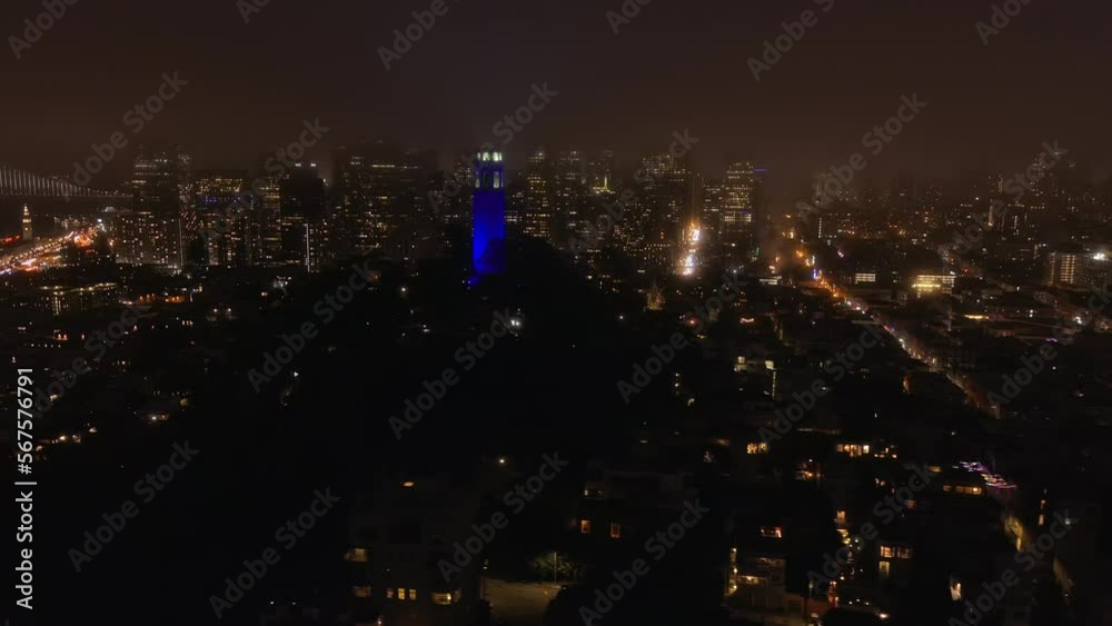 Aerial, 4th of July fireworks at night in San Francisco, Coit Tower in view Aerial, 4th of July fireworks at night in San Francisco, Coit Tower in view