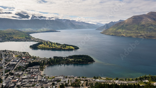 Panoramic view over Queenstown and Lake Wakatipu on the South Island of New Zealand with the Remarkables mountains in the distance