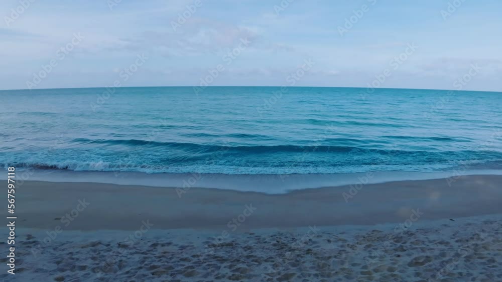 Sea waves crashing on sandy shore water surface,Amazing waves sea nature and travel background, Aerial view ocean beach background Sea waves crashing on sandy shore water surface,Amazing waves sea nature and travel background, Aerial view ocean beach background