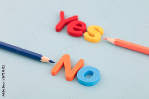 The colored pencil points to yes and no