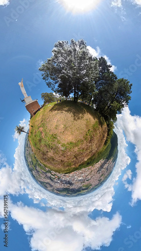 Christ Statue, Poços de Caldas, Minas Gerais, Brazil. 360º panorama from the top of the mountain. Little planet. Blue sky with white clouds. photo