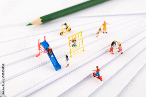 Children playing and relaxing on miniature creative white paper