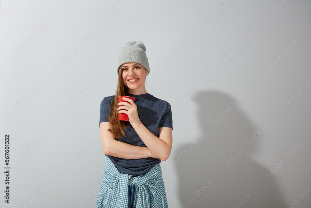 Isolated portrait of smiling girl with red coffee cup. Isolated portrait of smiling girl with red coffee cup.