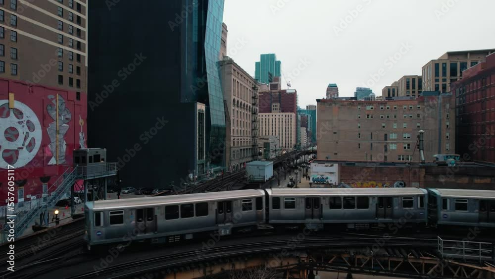 Cityscape Of Long Chicago Commuter Subway Sparking As It Passes Through Downtown Center. Cityscape Of Long Chicago Commuter Subway Sparking As It Passes Through Downtown Center.