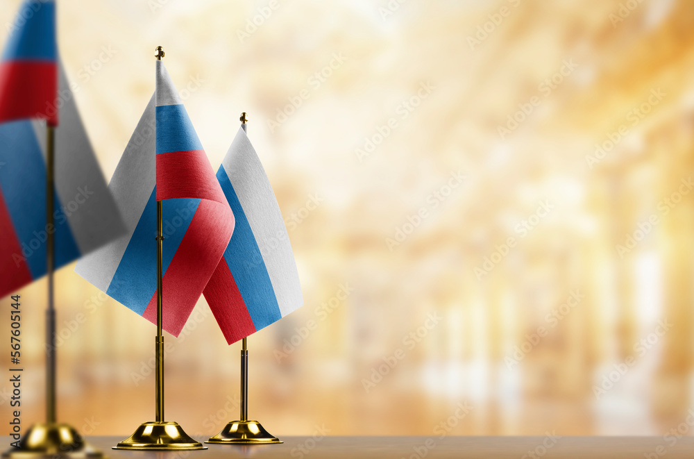 Fototapeta premium Small flags of the Russia on an abstract blurry background