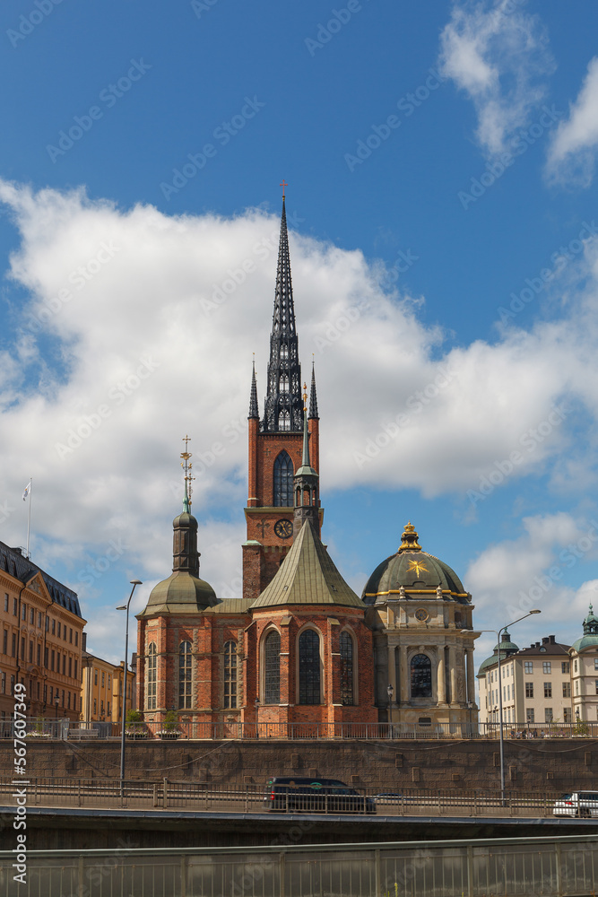 Fototapeta premium Riddarholmen Church and ornamented spire with scenic street view