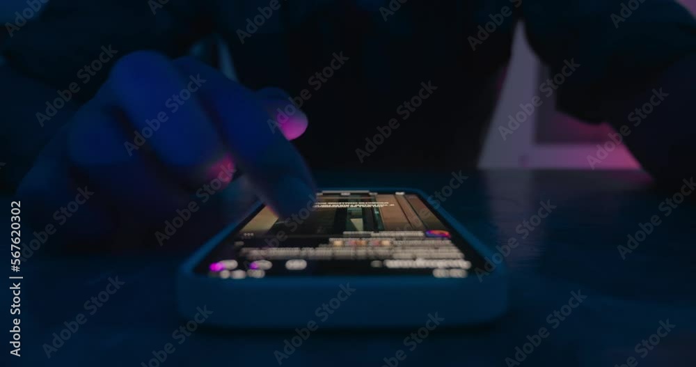Close up male finger scroll smartphone screen social networks at night. Male hand scroll mobile screen app on smartphone surf internet web pages, social media, timelapse. Concept of using smartphone