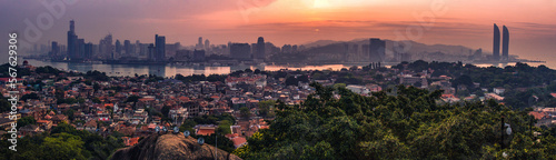 A panorama of Gulangyu Island and the coast of Xiamen City taken from "Sunlight" rock at sunrise.