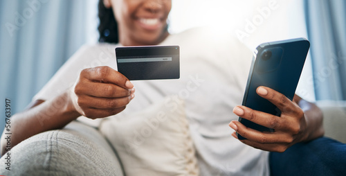 Phone, online shopping or black woman with credit card for payment, internet purchase or ecommerce in living room. Fintech, happy or girl on smartphone for trading, banking or invest on home sofa